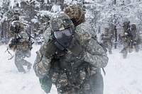 U.S. Army Spc. Durrell Jones carries Sgt. 1st Class Amy Fields, both with the 982nd Combat Camera Company (Airborne), during the Combat Support Training Exercise (CSTX) at Fort Knox, Kentucky, March 21, 2018.