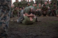 U.S. Marines with Headquarters Battalion (HQBN), 2nd Marine Division (2d MARDIV), grapple during a Commander's Cup field meet at Camp Lejeune, North Carolina, Feb. 16, 2018.