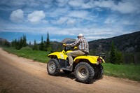 A elderly man rides his all-terrain vehicle (ATV) with his family in the Gravelly Mountain Range of Beaverhead-Deerlodge National Forest.