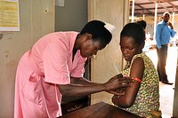 Uganda: NutritionHellen, a nurse in the ANC clinic of Jinja Regional Referral Hospital assesses the nutritional status of Proskovia, a 20 year old woman who is 3 months pregnant with her third child.