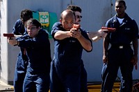 U.S. Sailors learn tactical movement techniques during a security reaction force class aboard the amphibious command ship USS Blue Ridge (LCC 19) while under way in the Pacific Ocean Nov. 12, 2009, during a scheduled deployment.