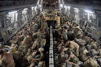 U.S. Army paratroopers assigned to the 2nd Brigade Combat Team, 82nd Airborne Division, stationed at Fort Bragg, N.C., load onto a C-17 Globemaster III aircraft, during the Joint Readiness Training Center exercise, April 7, 2018, at the Alexandria International Airport, Louisiana.