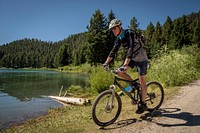 A man mountain bikes near Wade Lake in the Beaverhead-Deerlodge National Forest.