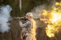 Oregon Army National Guard Spc. Michael Norris fires the M136E1 AT4-CS confined light anti-armor weapon while competing in the National Guard Best Warrior Region VI 2018 at Joint Base Elmendorf-Richardson, Alaska, May 15, 2018. National Guard Best Warrior Region VI 2018 is a four-day competition that tests Soldiers' mental and physical toughness through a series of events that demonstrate technical and tactical proficiency to determine the top non-commissioned officer and junior enlisted Soldier. The competitors represent the top Soldiers from Alaska, Idaho, Montana, North Dakota, Oregon, South Dakota, Washington, and Wyoming. (U.S. Air Force photo by Alejandro Peña). Original public domain image from Flickr