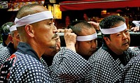 Sanja Festival Asakusa. Sanja Matsuri ("Three Shrine Festival"), or Sanja Festival, is one of the three great Shinto festivals in Tokyo. It is considered one of the wildest and largest.[1] The festival is held in honor of Hinokuma Hamanari, Hinokuma Takenari, and Hajino Nakatomo, the three men who established and founded Sensō-ji. Sanja Matsuri is held on the third weekend of every May at Asakusa Shrine. Its prominent parades revolve around three mikoshi (portable shrines referenced in the festival's name), as well as traditional music and dancing. Over the course of three days, the festival attracts 1.5 to 2 million locals and tourists every year. Original public domain image from Flickr