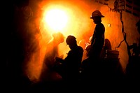 Rescue teams work to free a 25-year-old Haitian woman from a collapsed building in Port-au-Prince, Haiti, Jan. 19, 2010.