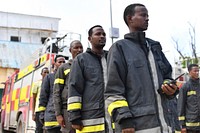 Members of the Mogadishu's Fire and Emergency Response Service serving under the Benadir Regional Administration, on parade as they take part in a routine morning drill in Mogadishu, Somalia, on 26 May 2018. UN Photo / Omar Abdisalan. Original public domain image from Flickr
