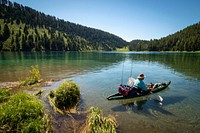 A man launches from a dock on Wade Lake for a day of fishing in the Beaverhead-Deerlodge National Forest.