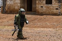 Royal Canadian Navy Leading Seaman Chad Downey, a clearance diver assigned to Fleet Dive Unit (Atlantic), inspects a simulated improvised explosive device (IED) during the Rim of the Pacific (RIMPAC) exercise at Schofield Barracks, Hawaii, July 20, 2018.