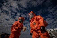 U.S. Army Sgt. Mauricio Caceres and Sgt. Cory Sweetman perform decontamination procedures during an exercise at Atlantic City International Airport, N.J., Nov. 7, 2018.
