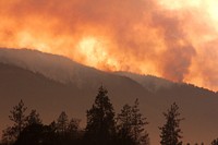 Sunset of SmokeThe smoke of the Taylor Creek Fire still plumes behind the Joint Information Center, just outside of Grants Pass, OR. Darren Stebbins 7-28-18. Original public domain image from Flickr