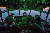 U.S. Air Force Maj. Greg Hafley, left, and Capt. Phil Hoover, C-130 Hercules aircraft pilots assigned to the 139th Airlift Wing, Missouri Air National Guard, participate in a personnel drop during Saber Junction 18 inGermany, Sept. 19, 2018.