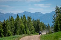 A family rides their all-terrain vehicles (ATVs) in the Gravelly Mountain Range of Beaverhead-Deerlodge National Forest.