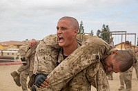 A recruit with Charlie Company, 1st Recruit Training Battalion, fireman-carries another recruit during a combat conditioning exercise at Marine Corps Recruit Depot San Diego, Sept. 5, 2018.