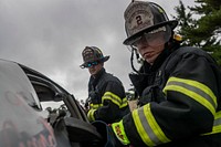 New Jersey Department of Military and Veterans Affairs Fire Captains William Ferguson, right, and Brian Bramhall train with extraction gear on Atlantic City Air National Guard Base, N.J., Sept. 25, 2018.