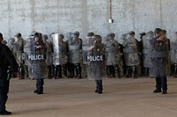 U.S. Soldiers and Marines assigned to Special Purpose Marine Air-Ground Task Force 7, practice non-lethal crowd control drills at the Calexico West Port of Entry in Calexico, California on Nov. 27, 2018.