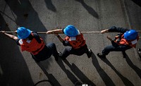 MEDITERRANEAN SEA. Sailors heave line during a man overboard drill aboard the Arleigh Burke-class guided-missile destroyer USS Carney (DDG 64) Oct. 24, 2018.