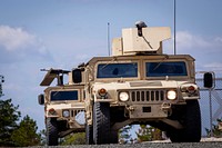 U.S. Army Soldiers with the 253rd Transportation Company, New Jersey Army National Guard, prepare to enter a simulated village in Humvees during the Company’s annual evaluation at Joint Base McGuire-Dix-Lakehurst, N.J., April 8, 2019. The Cape May-based Soldiers were evaluated by 1st Army Soldiers from the 1-315th Brigade Support Battalion, 174th Infantry Brigade, on numerous combat tasks including reacting to a chemical threat and improvised explosive devices, evacuating casualties while under fire, and recovering disabled vehicles. (New Jersey National Guard photo by Mark C. Olsen). Original public domain image from Flickr