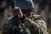 U.S. Army Sgt. Aaron Edgerton demonstrates how to reload an M249 Squad Automatic Weapon during training on Joint Base McGuire-Dix-Lakehurst, N.J., April 16, 2019.