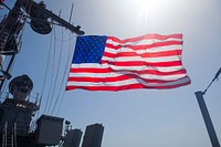 MEDITERRANEAN SEA. The national ensign flies from the mast aboard the Ticonderoga-class guided-missile cruiser USS Leyte Gulf (CG 55).