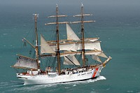 The crew aboard USCGC Eagle (WIX 327) takes in the ship's sails en route to Corpus Christi, Texas, July 2, 2010. (DoD photo by Petty Officer 2nd Class Patrick Kelley, U.S. Coast Guard/Released). Original public domain image from Flickr