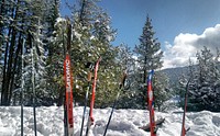 Cross-country skiers store their skis in a snow drift while enjoying the cozy warming hut at Frater Lake on the Colville National Forest. Original public domain image from Flickr