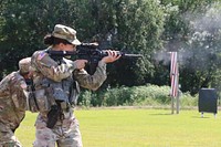 U.S. Army Spc. Micah Redenbaugh, a supply specialist assigned to the 170th Support Maintenance Company, fires at her target during the Reflexive Fire event at the annual Adjutant General’s Marksmanship Competition (TAG Match) hosted at the Great Plains Joint Training Center’s small arms range in Salina, Kansas, August 10, 2019.