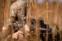 Army solider shooting gun. Original public domain image from Flickr