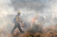 Blacklining the Trout Springs Rx Fire. A firefighter works in smoky conditions.(DOI/Neal Herbert). Original public domain image from Flickr