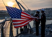 GAETA, Italy (Oct. 29, 2019) Cryptologic Technician, Technical, 2nd Class Nareba Brady, left, and Yeoman 2nd Class Jerrell Pouncy shift Colors aboard the Blue Ridge-class command and control ship USS Mount Whitney (LCC 20) as the ship makes port in Gaeta, Italy, Oct. 29, 2019.