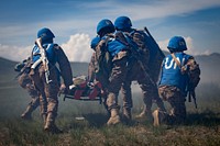 Mongolian Armed Forces service members evacuate a notional casualty during a care-under-fire training scenario for Khaan Quest 2019 at Five Hills Training Area, Ulaanbaatar, Mongolia, June 19, 2019.