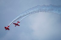 Aircraft fly overhead during the 2019 EAA AirVenture Oshkosh July 25, 2019, in Oshkosh, Wisconsin.