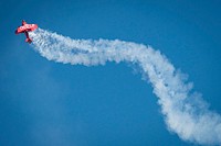 Aircraft fly overhead during the 2019 EAA AirVenture Oshkosh July 25, 2019, in Oshkosh, Wisconsin.