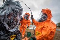 Survey team members with the 21st Weapons of Mass Destruction-Civil Support Team (21st WMD-CST), New Jersey National Guard, decontaminate Survey Team Member Sgt. Eric Boyer during a training exercise at the William J. Hughes Technical Center Federal Aviation Administration, Egg Harbor Township, N.J., Feb. 11, 2020. The scenarios were created by staff from the Edgewood Chemical Biological Center at Aberdeen Proving Ground, Md. The 21st WMD-CST supports civil authorities at man-made or natural disasters by identifying chemical, biological, radiological, and nuclear substances, assess the consequences, and advises on response measures. (New Jersey National Guard photo by Mark C. Olsen). Original public domain image from Flickr