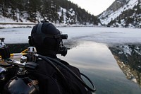 PANTICOSA, Spain (Feb. 3, 2020) An explosive ordnance disposal technician, from Explosive Ordnance Disposal Mobile Unit 8 (EODMU 8), assigned to Navy Expeditionary Combat Force Europe-Africa/Task Force (CTF) 68, performs pre-diving supervisor checks, as part of annual bi-lateral altitude and ice dive training in the Pyrenees Mountains with divers from the Spanish Navy Center for Diving (Centro de Buceo de la Armada, CBA), Feb. 3, 2020.