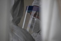 A New Jersey Air National Guard Airman from the 108th Medical Group stands by to assist patients at a COVID-19 Community-Based Testing Site at the PNC Bank Arts Center in Holmdel, N.J., March 23, 2020.