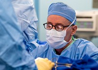 Md performs surgery in an operating room aboard the hospital ship. (U.S. Navy photo by Mass Communication Specialist 2nd Class Ryan M. Breeden). Original public domain image from Flickr