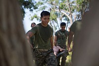 U.S. Navy officers carry a mannequin on a stretcher during the North County Corpsman Cup on Camp Pendleton. (U.S. Marine Corps photo by Lance Cpl. Joseph Sorci). Original public domain image from Flickr