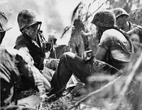 Corporal treating two wounded Marines on the beach during the World War 2. Headquarters Number 83573. Original public domain image from Flickr