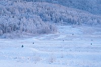 Targets are seen downrange in the waning afternoon light as paratroopers assigned to the 2nd Battalion, 377th Parachute Field Artillery Regiment, 4th Infantry Brigade Combat Team (Airborne), 25th Infantry Division, U.S. Army Alaska, use M240B, and M2 machine guns while conducting live-fire qualification at Grezelka range, on Joint Base Elmendorf-Richardson, Alaska, Dec. 5, 2019. The Soldiers practiced identifying, and engaging targets at varying distances to solidify their proficiency with the weapons in sub-arctic conditions. (U.S. Air Force photo/Justin Connaher). Original public domain image from Flickr