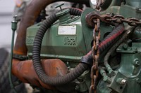 A damaged engine from an M984A2 Heavy Expanded Mobility Tactical Truck wrecker rests on jack stands in the 109th Transportation Company, 17th Combat Sustainment Support Battalion, U.S. Army Alaska, motor pool on Joint Base Elmendorf-Richardson, Alaska, Dec. 13, 2019. The M984A2 is an eight-wheel drive, diesel-powered, variant of the HEMTT used in vehicle recovery operations. (U.S. Air Force photo/Justin Connaher). Original public domain image from Flickr