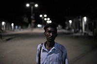 A Somali Police officer on patrol along a street during an operation in Wardhiigleey district aimed to improve security in Mogadishu, Somalia, on 21 May 2013. AU-UN IST Photo / Tobin Jones. Original public domain image from Flickr