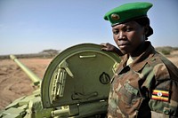 Tank gunner, Lance Corporal Nappijja Catherine of the Uganda Peoples Defence Forces. She operates the 100mm gun. She is one of the 6 ladies who are part of the armoured brigade. AU/UN IST PHOTO / David Mutua. Original public domain image from Flickr