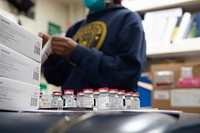 Hospital corpsman petty officer prepares the COVID-19 vaccine to administer to the crew of Ticonderoga-class guided-missile cruiser USS Monterey (CG 61). (U.S. Navy photo by Mass Communication Specialist Seaman Chelsea Palmer). Original public domain image from Flickr