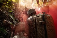 190607-N-TH560-0164 CAMP GONSALVES, Okinawa, Japan (June 7, 2019) Hospital Corpsmen respond to a simulated patient casualty during a tactical combat casualty care exercise as part of a rigorous Jungle Medicine Course at Jungle Warfare Training Center, Okinawa, Japan.