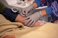 200714-N-VI515-1011 SAN DIEGO (July 14, 2020) Sarahi Wilson, a phlebotomist assigned to Naval Medical Center San Diego (NMCSD), draws blood from a volunteer at NMCSD’s Blood Donation Center June 14.