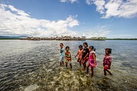 Bermain di laut dangkalChildren make the most of a calm day at Torosiaje village to forage for sea food. Sulawesi.Photo courtesy of USAID SEA. Original public domain image from Flickr