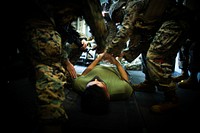 36th MEU Nightingale: Mass Casualty Drill 2. PHILIPPINE SEA (Sept. 10, 2020) A Marine with the 31st Marine Expeditionary Unit (MEU) is laid out on a stretcher as a simulated casualty during a mass casualty drill aboard amphibious assault ship USS America (LHA 6).