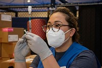 CFAY conducts COVID-19 vaccinations for 12 to 17-year-olds YOKOSUKA, Japan (May 20, 2021) – Laurei Fernandes, RN, an American Red Cross volunteer, prepares a syringe with the Pfizer COVID-19 vaccine during a vaccine distribution at Commander, Fleet Activities Yokosuka’s (CFAY) Hawk’s Nest. With Department of Defense authorization, CFAY began administering vaccines to Navy-sponsored Status of Forces Agreement (SOFA) children 12 to 17 years old during the two-day distribution.