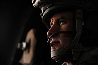 U.S. Air Force Tech. Sgt. Anthony Wood, a pararescueman with the 46th Expeditionary Rescue Squadron, scans his sector during a mission aboard an HH-60 Pave Hawk helicopter near Kandahar, Afghanistan, Dec. 24, 2010.